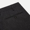 View 2 of product Turnbull & Asser Charcoal Grey Wool Manson Trousers, tailored in Italy with a straight-leg cut, front creases, belt loops, and button closure, are displayed flat on a white background.