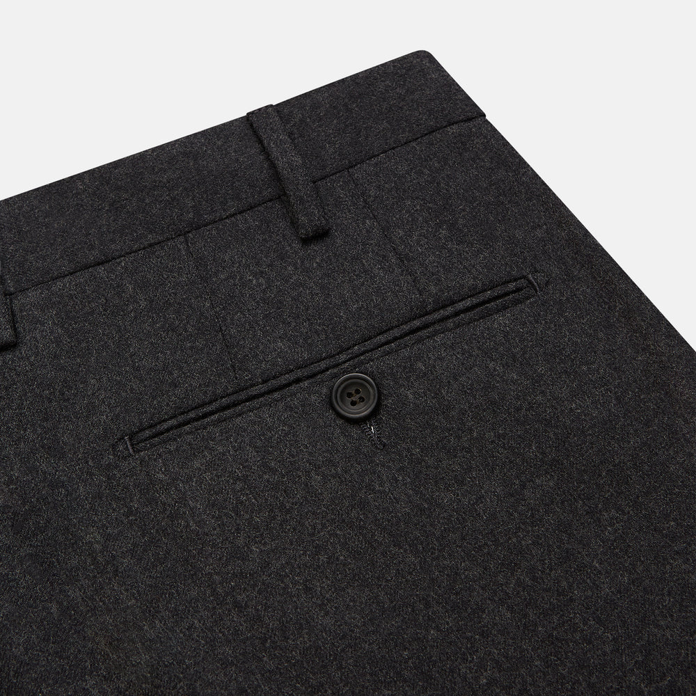 Turnbull & Asser Charcoal Grey Wool Manson Trousers, tailored in Italy with a straight-leg cut, front creases, belt loops, and button closure, are displayed flat on a white background.