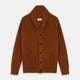 The Brown Ainsley Ribbed Shawl Cashmere Cardigan by Turnbull & Asser features a ribbed knit texture, black front buttons, and two front pockets, displayed laid flat on a white background.