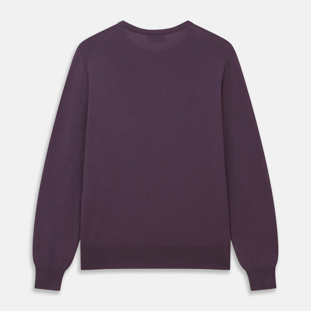 The Turnbull & Asser Plum Kingston Merino Crew Neck Jumper is a lightweight, long-sleeve sweater with ribbed cuffs and hem, shown flat on a white background. Its solid plum color and classic design offer timeless style.