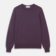 The Turnbull & Asser Plum Kingston Merino Crew Neck Jumper is a lightweight, long-sleeve sweater with ribbed cuffs and hem, shown flat on a white background. Its solid plum color and classic design offer timeless style.