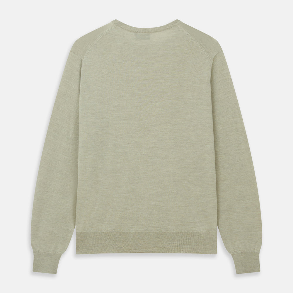 The Light Green Kingston Merino Crew Neck Jumper by Turnbull & Asser is laid flat, displaying its classic design with ribbed cuffs, hem, and neckline.