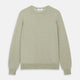 The Light Green Kingston Merino Crew Neck Jumper by Turnbull & Asser is laid flat, displaying its classic design with ribbed cuffs, hem, and neckline.