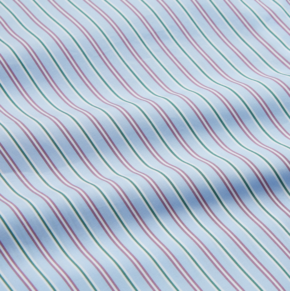 The Blue, Purple & Green Stripe Nightshirt by Turnbull & Asser is a long-sleeved, knee-length traditional nightshirt with a pointed collar, breast pocket with green trim, front buttons, and buttoned cuffs; made in England.