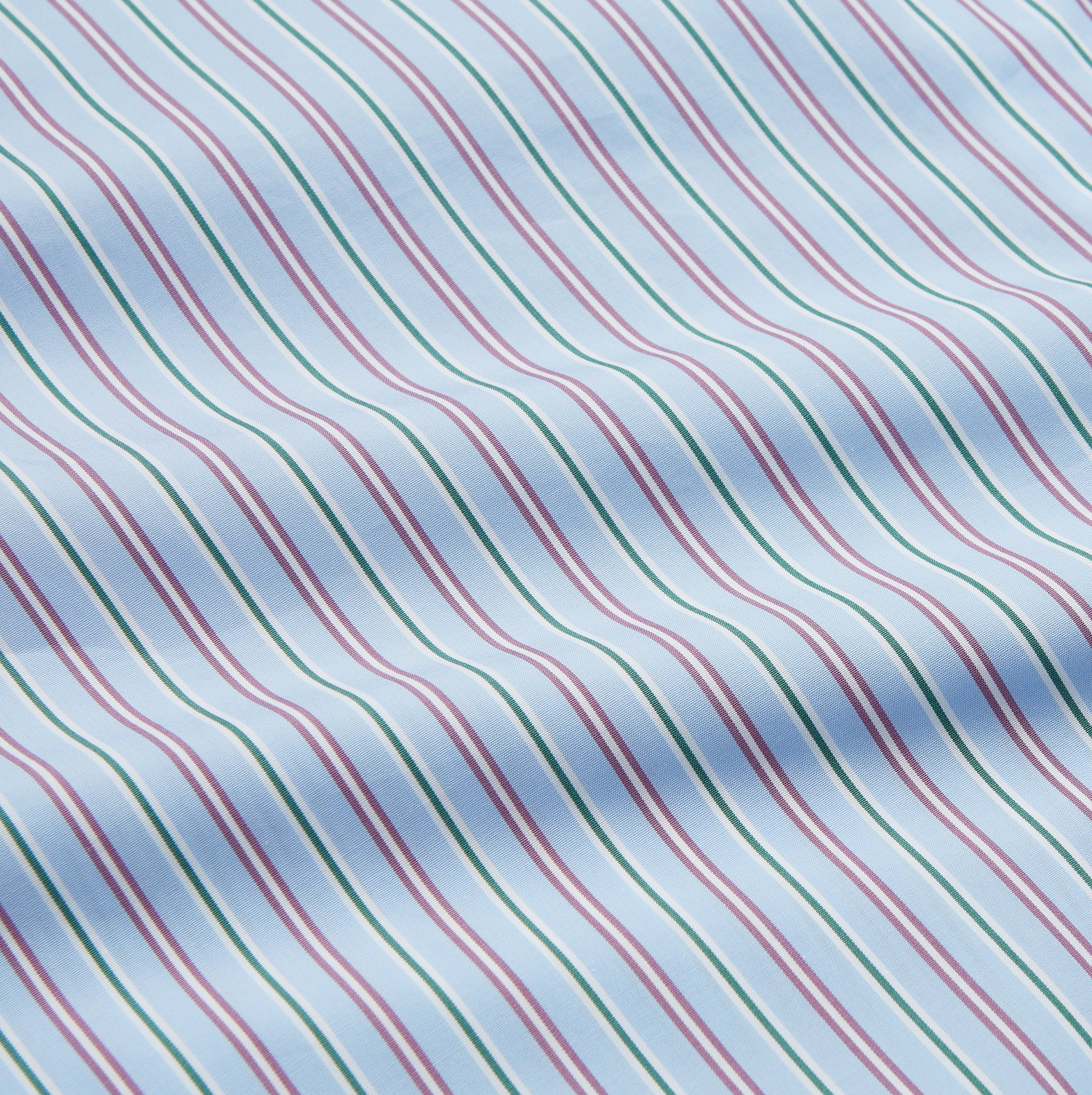 View 4 of product The Blue, Purple & Green Stripe Nightshirt by Turnbull & Asser is a long-sleeved, knee-length traditional nightshirt with a pointed collar, breast pocket with green trim, front buttons, and buttoned cuffs; made in England.