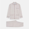 View 1 of product The Turnbull & Asser Red Multi Check Cotton-Cashmere Modern Pyjama Set, made in England, features a long-sleeve button-up shirt and pants in red and gray plaid with dark piping, crafted from soft Italian cotton-cashmere.