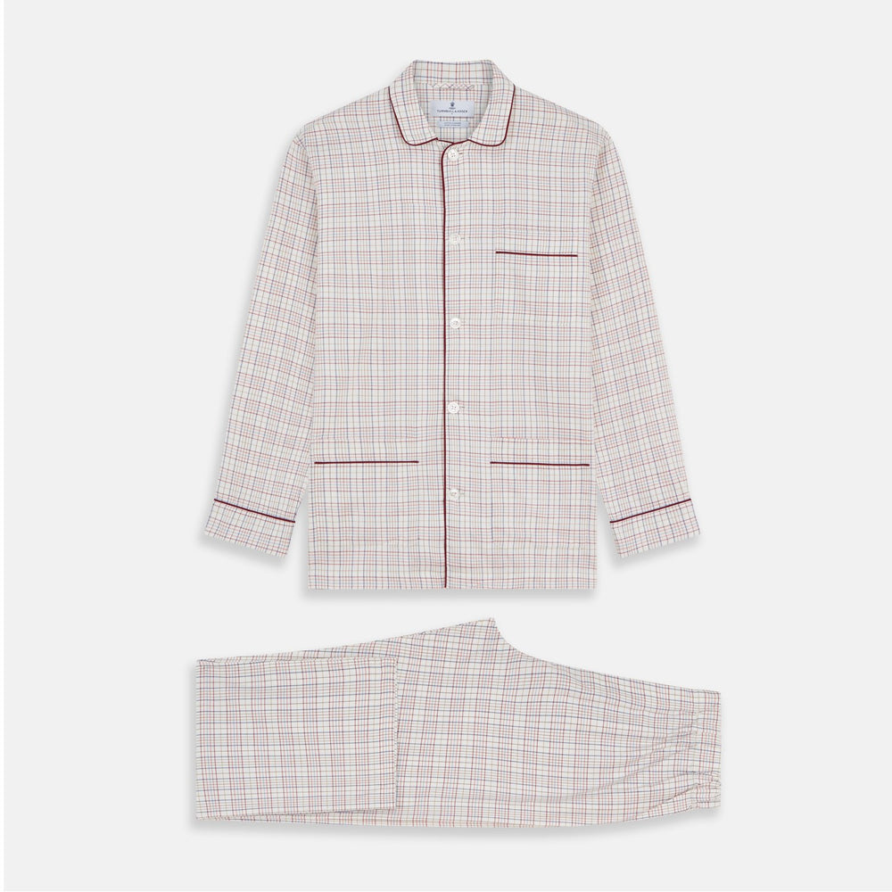 The Turnbull & Asser Red Multi Check Cotton-Cashmere Modern Pyjama Set, made in England, features a long-sleeve button-up shirt and pants in red and gray plaid with dark piping, crafted from soft Italian cotton-cashmere.