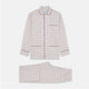 The Turnbull & Asser Red Multi Check Cotton-Cashmere Modern Pyjama Set, made in England, features a long-sleeve button-up shirt and pants in red and gray plaid with dark piping, crafted from soft Italian cotton-cashmere.