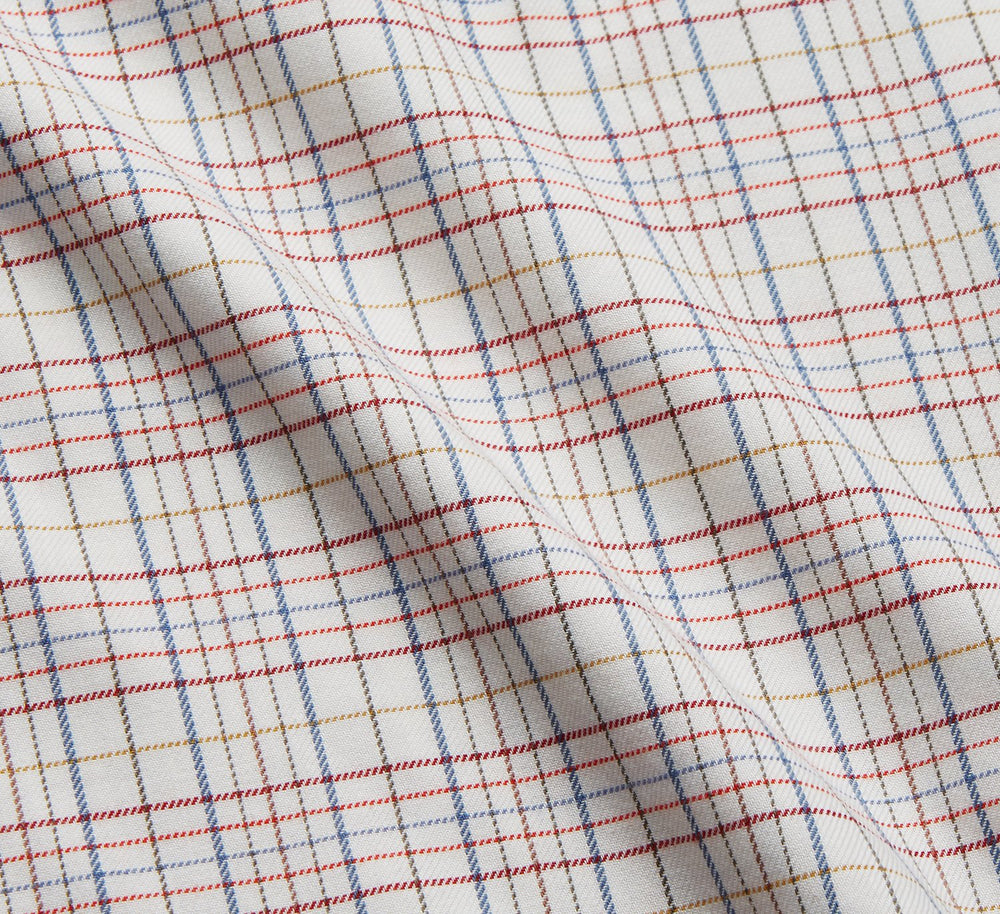 The Turnbull & Asser Red Multi Check Cotton-Cashmere Modern Pyjama Set, made in England, features a long-sleeve button-up shirt and pants in red and gray plaid with dark piping, crafted from soft Italian cotton-cashmere.