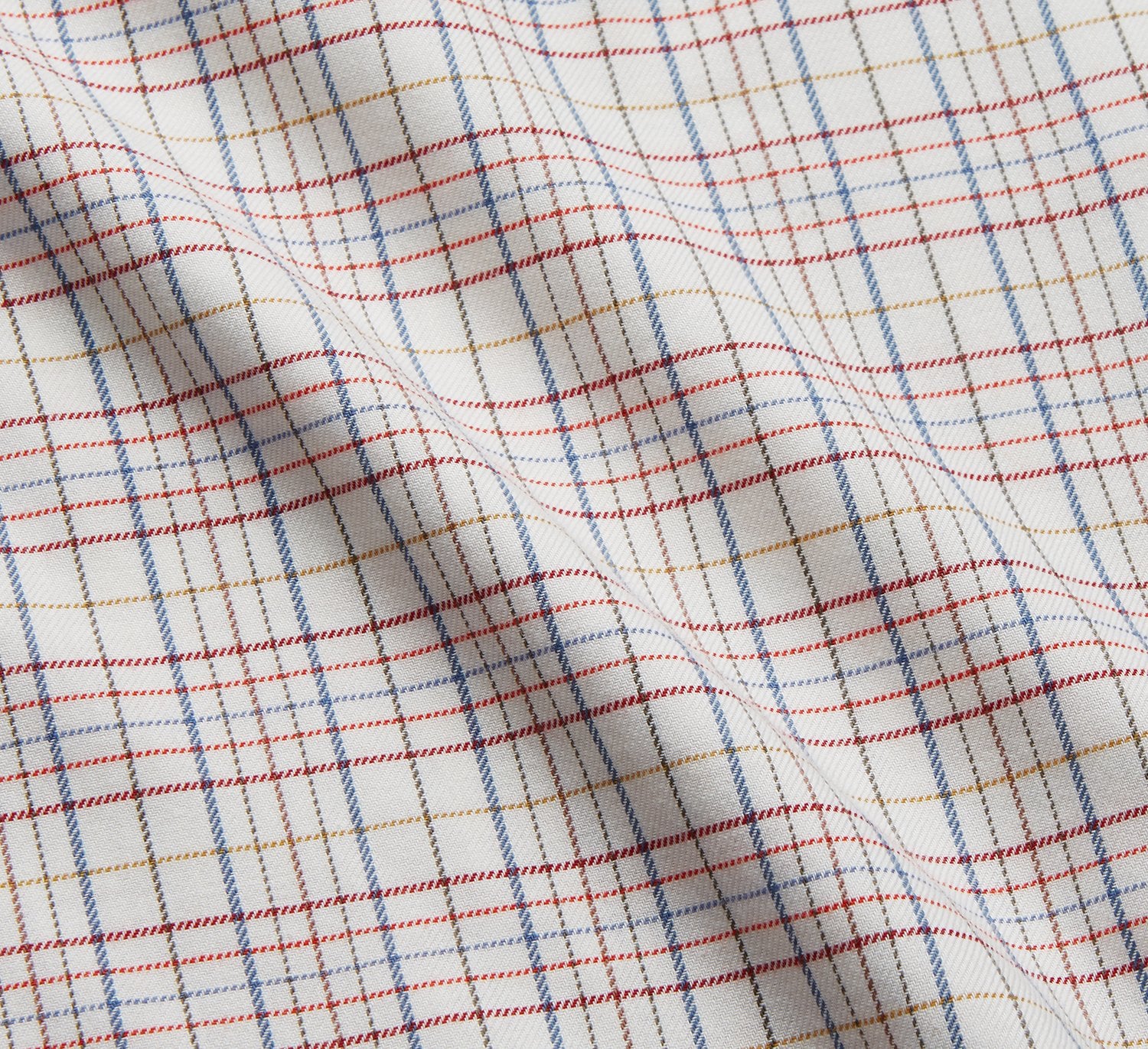 View 4 of product The Turnbull & Asser Red Multi Check Cotton-Cashmere Modern Pyjama Set, made in England, features a long-sleeve button-up shirt and pants in red and gray plaid with dark piping, crafted from soft Italian cotton-cashmere.