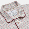 View 2 of product The Turnbull & Asser Red Multi Check Cotton-Cashmere Modern Pyjama Set, made in England, features a long-sleeve button-up shirt and pants in red and gray plaid with dark piping, crafted from soft Italian cotton-cashmere.