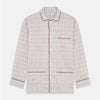 View 5 of product The Turnbull & Asser Red Multi Check Cotton-Cashmere Modern Pyjama Set, made in England, features a long-sleeve button-up shirt and pants in red and gray plaid with dark piping, crafted from soft Italian cotton-cashmere.