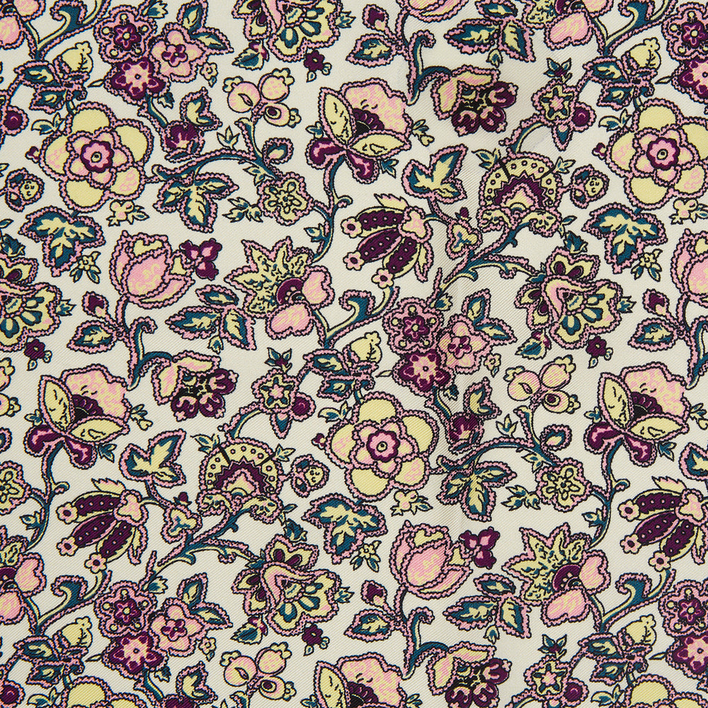 The White Floral Silk Pocket Square by Turnbull & Asser is crafted in England from silk, featuring a floral and paisley design in pink, purple, and gold with a navy border and the "TURNBULL & ASSER" logo in the corner.