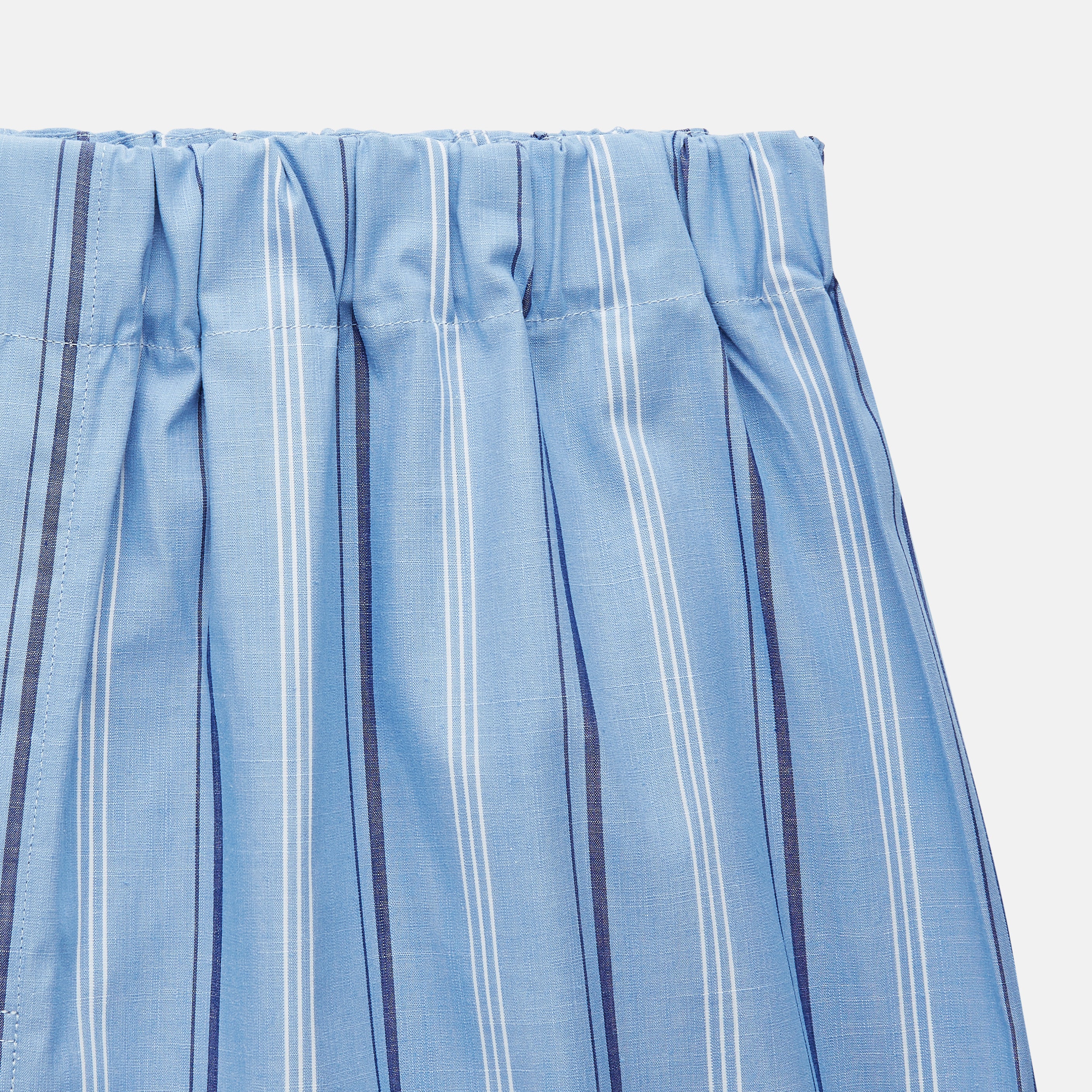 View 2 of product Turnbull & Asser Blue Multi Stripe Cotton Pyjama Trousers feature vertical navy and white stripes, a contemporary fit, and an elastic waistband, shown flat on a white background.