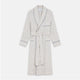 The Turnbull & Asser Brown Multi Check Cotton-Cashmere Gown features a shawl collar, front pocket, matching belt, and dark piping on the edges, sleeves, and pocket. Made in England and shown on a plain white background.