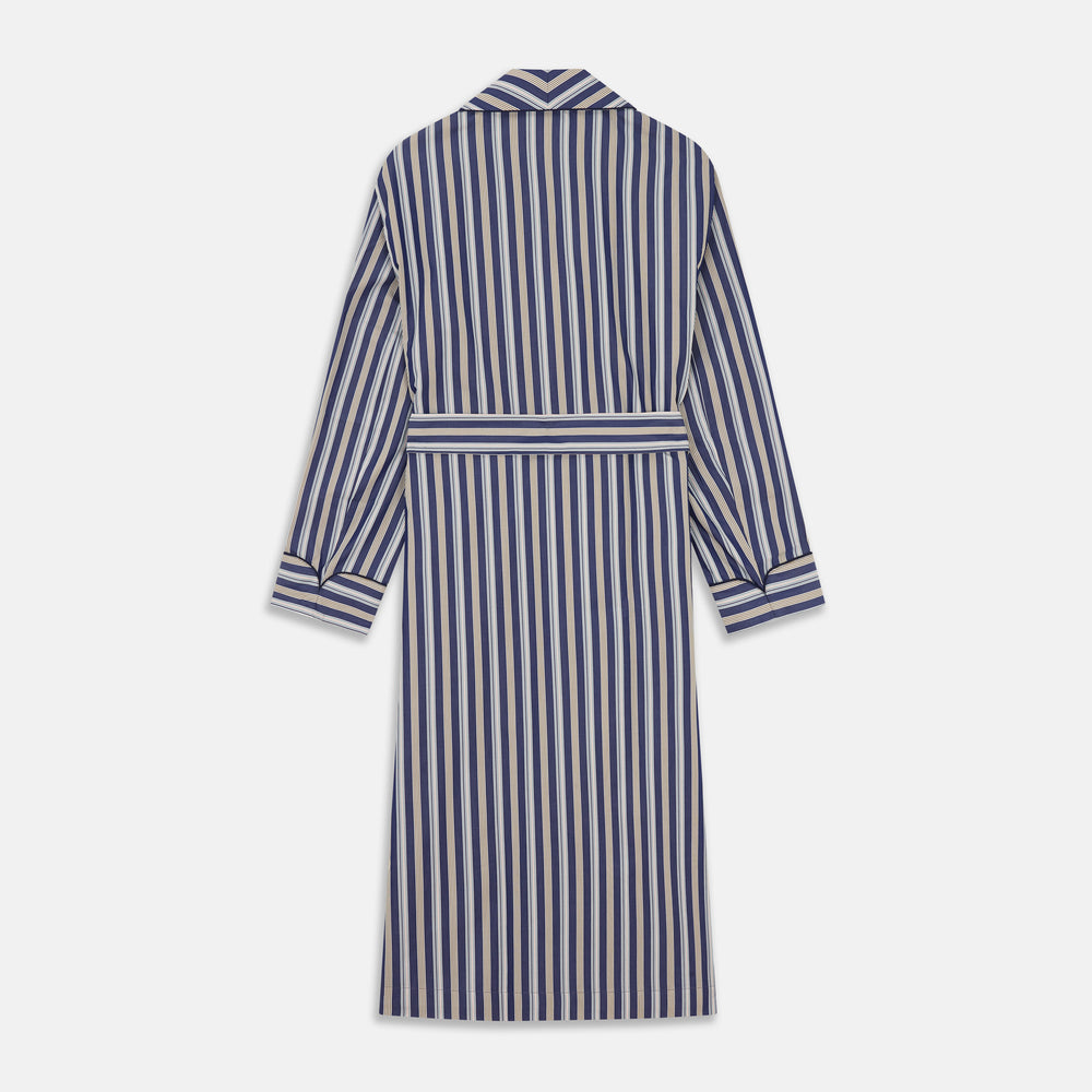 The Turnbull & Asser Blue Multi Stripe Cotton Gown features blue and white vertical stripes, long sleeves, a shawl collar, front pockets, and a matching waist tie, shown on a plain white background.