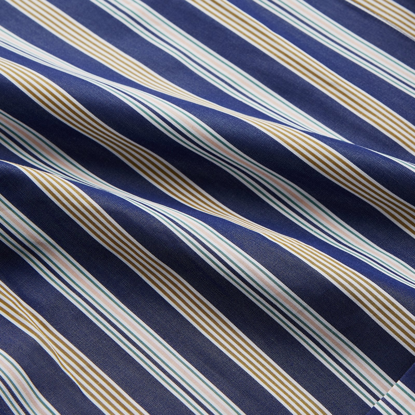 View 2 of product The Turnbull & Asser Blue Multi Stripe Cotton Gown features blue and white vertical stripes, long sleeves, a shawl collar, front pockets, and a matching waist tie, shown on a plain white background.