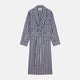 The Turnbull & Asser Blue Multi Stripe Cotton Gown features blue and white vertical stripes, long sleeves, a shawl collar, front pockets, and a matching waist tie, shown on a plain white background.