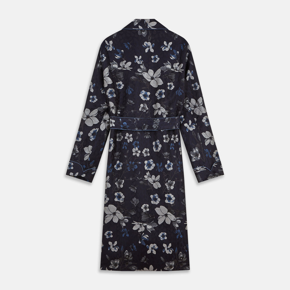The Navy Floral Silk Jacquard Pierce Gown by Turnbull & Asser features a shawl collar, long sleeves, matching fabric belt, and elegant grey and blue floral design.