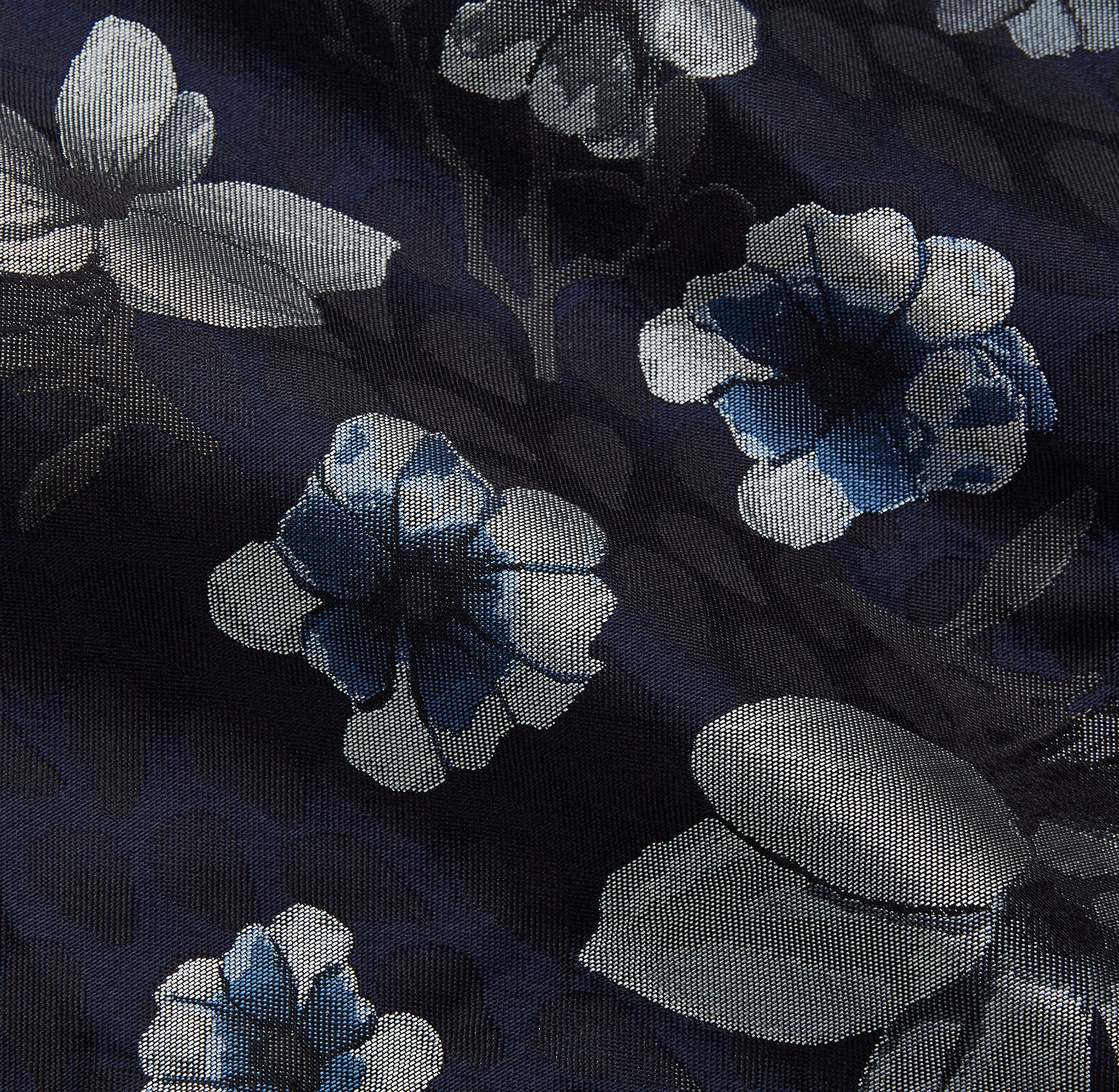 View 2 of product The Navy Floral Silk Jacquard Pierce Gown by Turnbull & Asser features a shawl collar, long sleeves, matching fabric belt, and elegant grey and blue floral design.