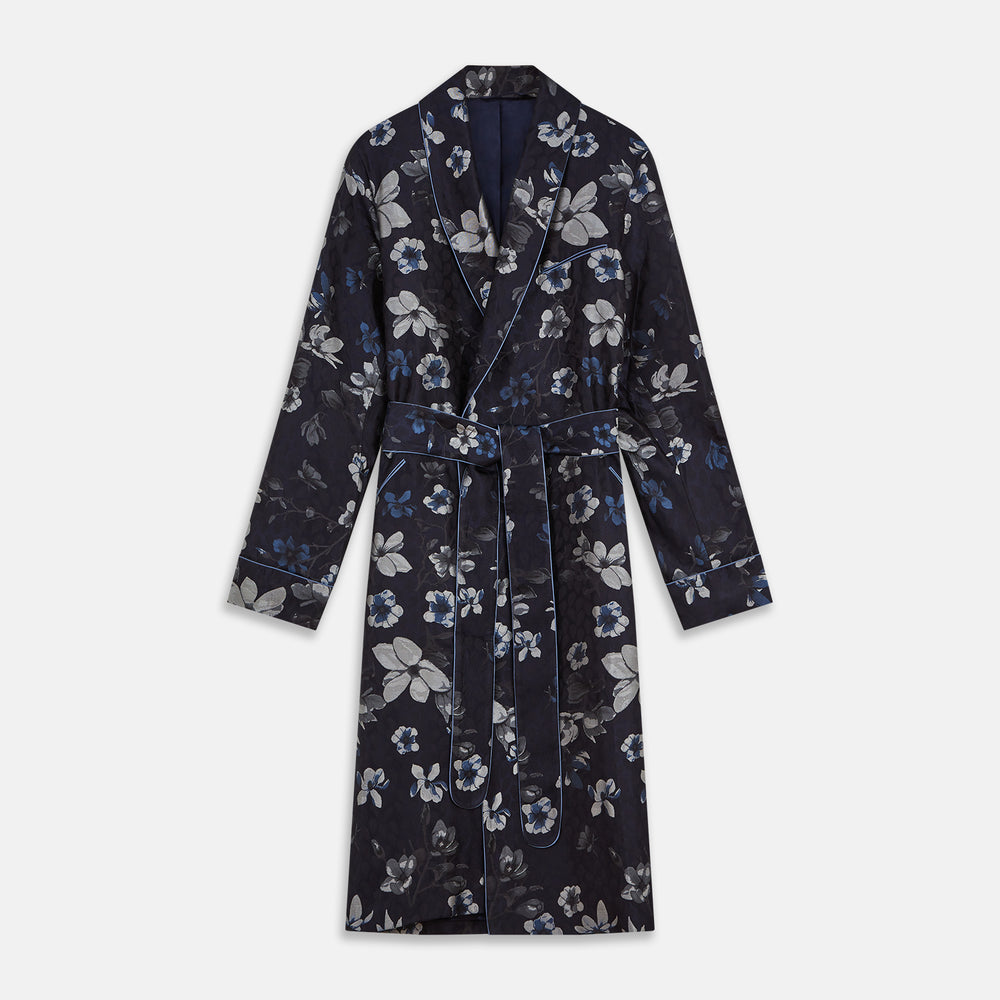 The Navy Floral Silk Jacquard Pierce Gown by Turnbull & Asser features a shawl collar, long sleeves, matching fabric belt, and elegant grey and blue floral design.