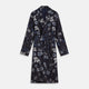 The Navy Floral Silk Jacquard Pierce Gown by Turnbull & Asser features a shawl collar, long sleeves, matching fabric belt, and elegant grey and blue floral design.
