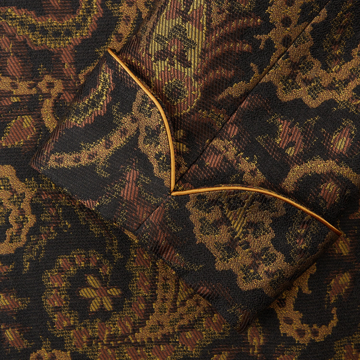 View 3 of product The Turnbull & Asser Gold Multi Floral Cotton, Wool & Silk Jacquard Pierce Gown features a shawl collar, matching belt, golden lining, and an elegant floral pattern in luxurious black, gold, and brown tones.