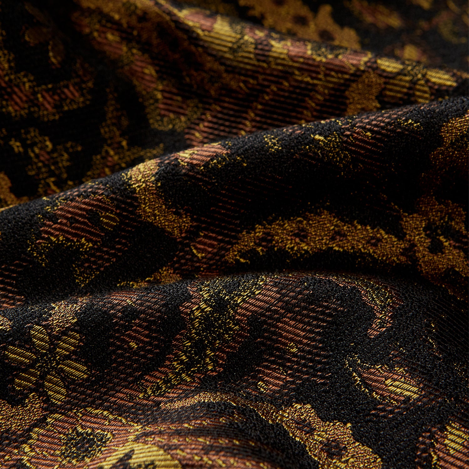 View 4 of product The Turnbull & Asser Gold Multi Floral Cotton, Wool & Silk Jacquard Pierce Gown features a shawl collar, matching belt, golden lining, and an elegant floral pattern in luxurious black, gold, and brown tones.