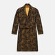 The Turnbull & Asser Gold Multi Floral Cotton, Wool & Silk Jacquard Pierce Gown features a shawl collar, matching belt, golden lining, and an elegant floral pattern in luxurious black, gold, and brown tones.