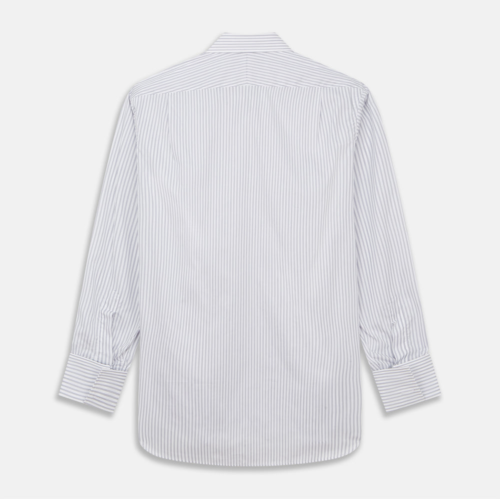 A man wearing the Turnbull & Asser Grey Multi Stripe Regular Fit Twill Shirt with T&A Collar and Double Cuffs stands against a beige background, one hand in his pocket, looking at the camera.