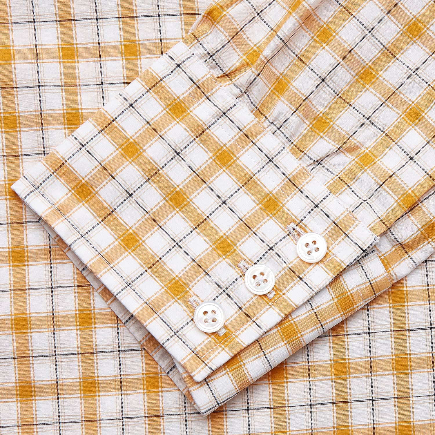 View 3 of product The Orange Multi Check Regular Fit Shirt by Turnbull & Asser features a T&A collar, 3 button cuffs, and a classic button-up design in Italian cotton, displayed on a plain white background.