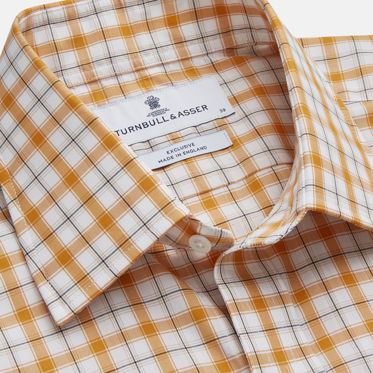 View 2 of product The Orange Multi Check Regular Fit Shirt by Turnbull & Asser features a T&A collar, 3 button cuffs, and a classic button-up design in Italian cotton, displayed on a plain white background.