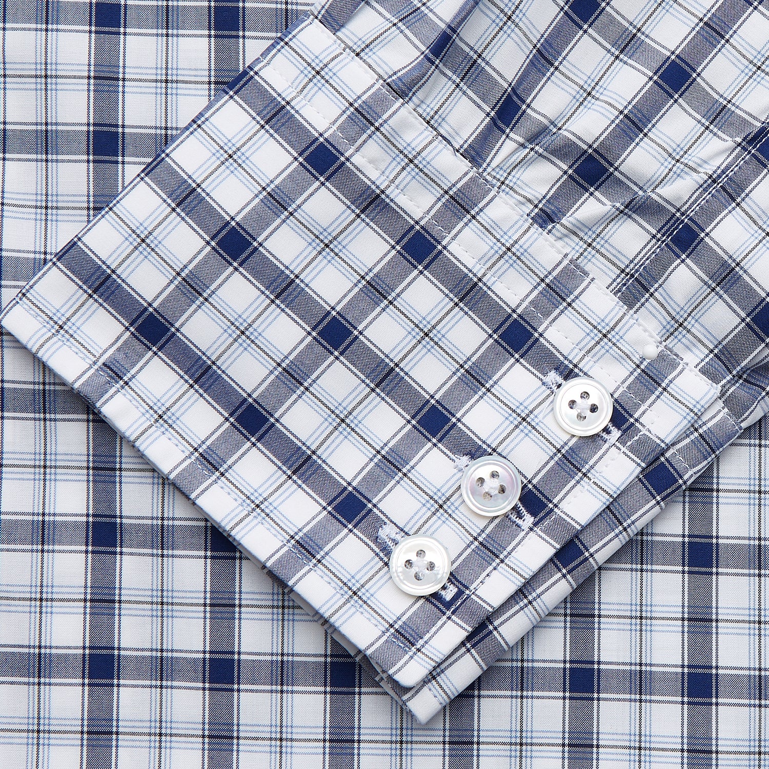 View 3 of product Turnbull & Asser's Navy Multi Check Regular Fit Shirt features a T&A collar, 3 button cuffs, and a blue and white plaid pattern, crafted from Italian cotton poplin with long sleeves and shown on a plain white background.