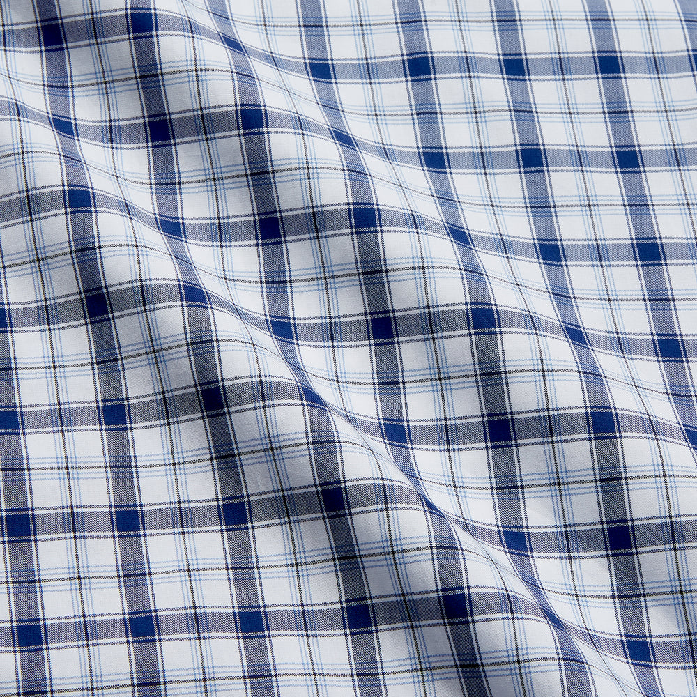 Turnbull & Asser's Navy Multi Check Regular Fit Shirt features a T&A collar, 3 button cuffs, and a blue and white plaid pattern, crafted from Italian cotton poplin with long sleeves and shown on a plain white background.