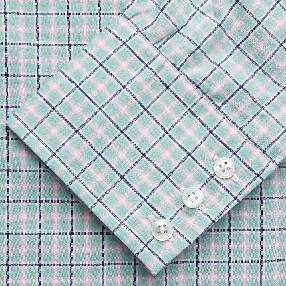 The Turnbull & Asser Green, Navy & Pink Check Regular Fit Shirt features a T&A collar, 3 button cuffs, and white buttons. Crafted from Italian cotton poplin, it’s displayed on a white background.