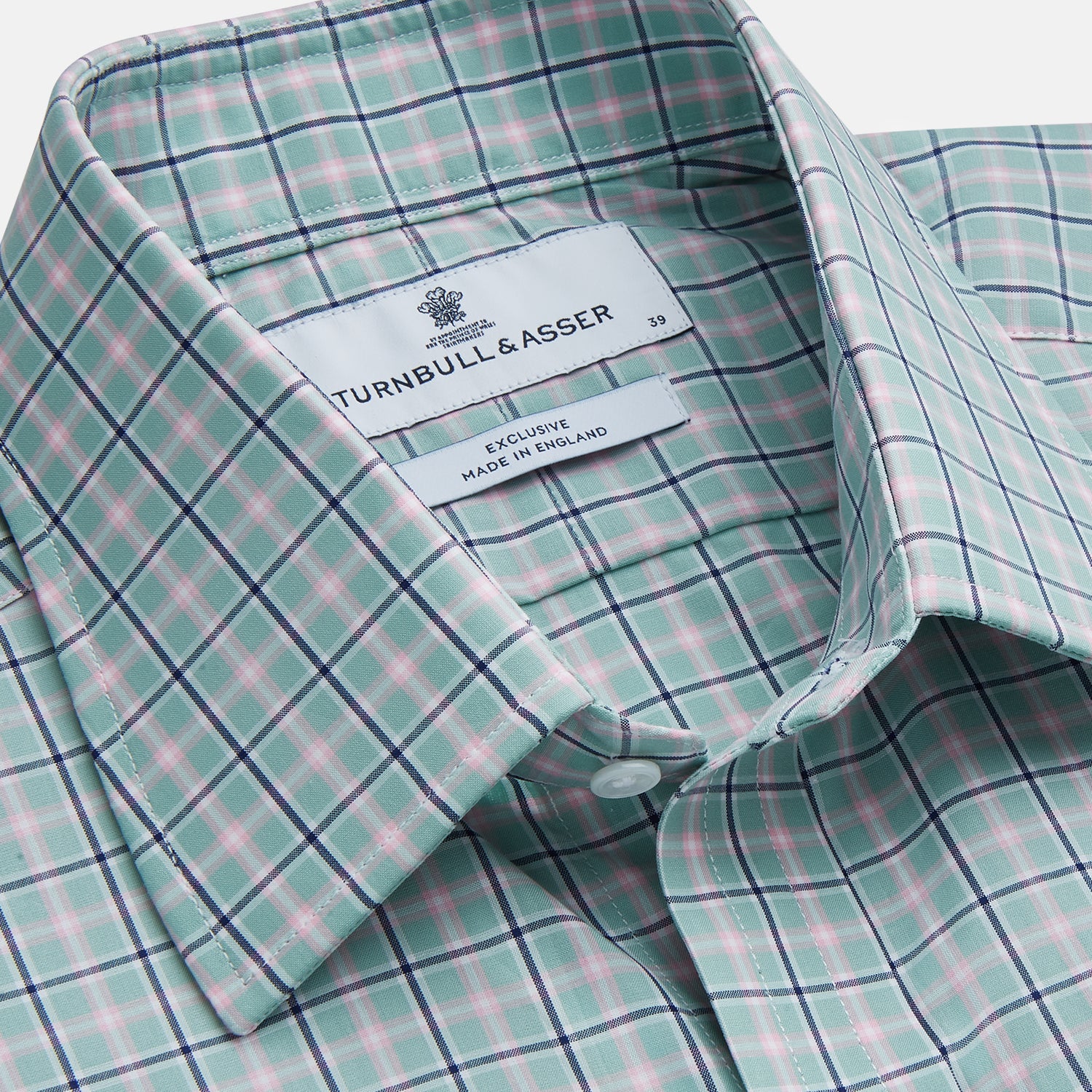 View 2 of product The Turnbull & Asser Green, Navy & Pink Check Regular Fit Shirt features a T&A collar, 3 button cuffs, and white buttons. Crafted from Italian cotton poplin, it’s displayed on a white background.