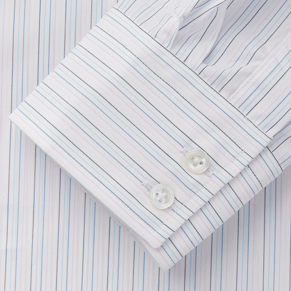 The Turnbull & Asser Blue Multi Stripe Tailored Fit Shelton Shirt features a Kent collar and thin blue and gray vertical stripes on white. This long-sleeve, button-down is displayed neatly against a plain white background.