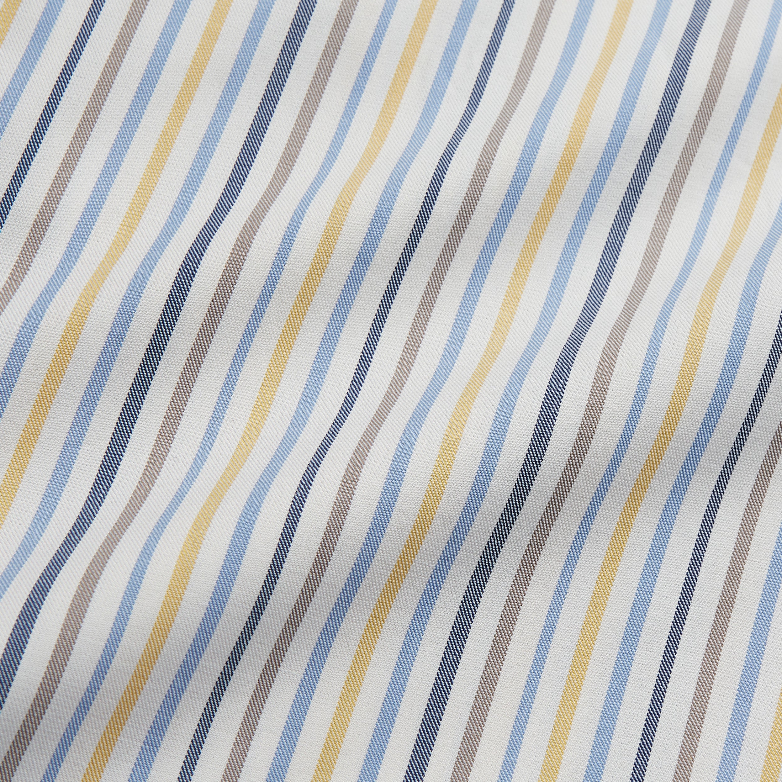 View 4 of product Turnbull & Asser’s Yellow Multi Stripe Tailored Fit Shirt features a Kent collar, blue, yellow, and white stripes on a light background, 2-button cuffs, and a curved hem for a refined look.