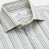 View 2 of product The Turnbull & Asser Green Multi Stripe Tailored Fit Shirt features a Kent collar, 2-button cuffs, and vibrant multicolored stripes, shown flat against a white background.