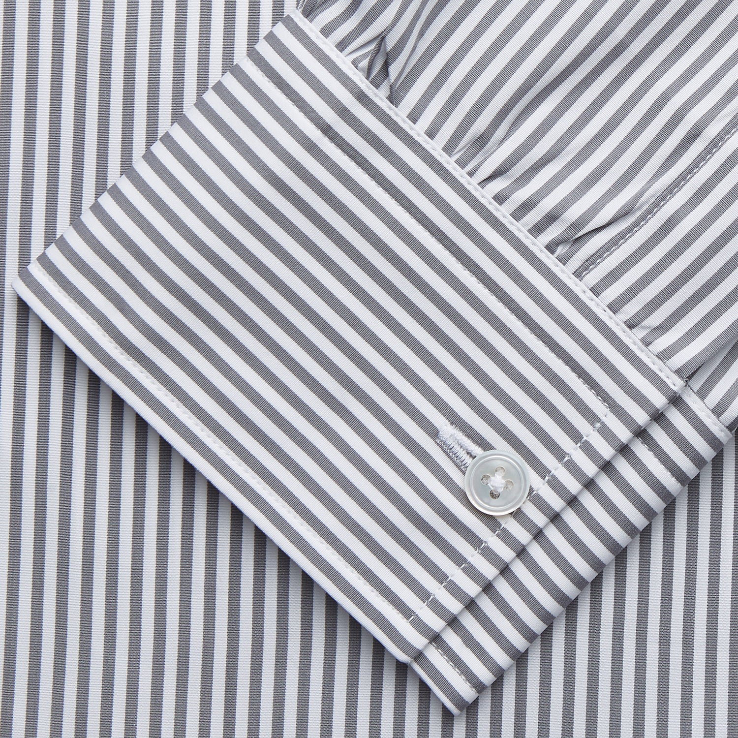 View 3 of product The Turnbull & Asser Grey & White Stripe Weekend Fit Shirt features a Derby collar, 1-button cuffs, and chest pocket—ideal for casual weekends. Shown on a plain white background.