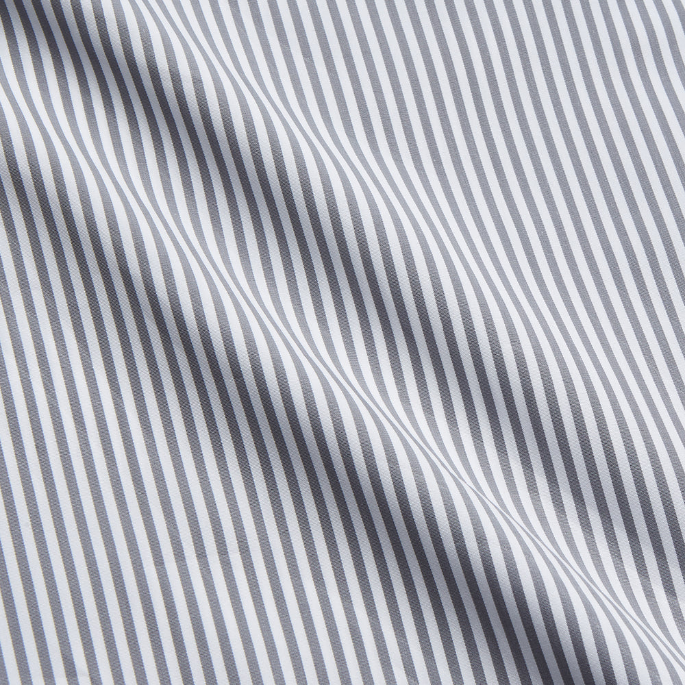The Turnbull & Asser Grey & White Stripe Weekend Fit Shirt features a Derby collar, 1-button cuffs, and chest pocket—ideal for casual weekends. Shown on a plain white background.