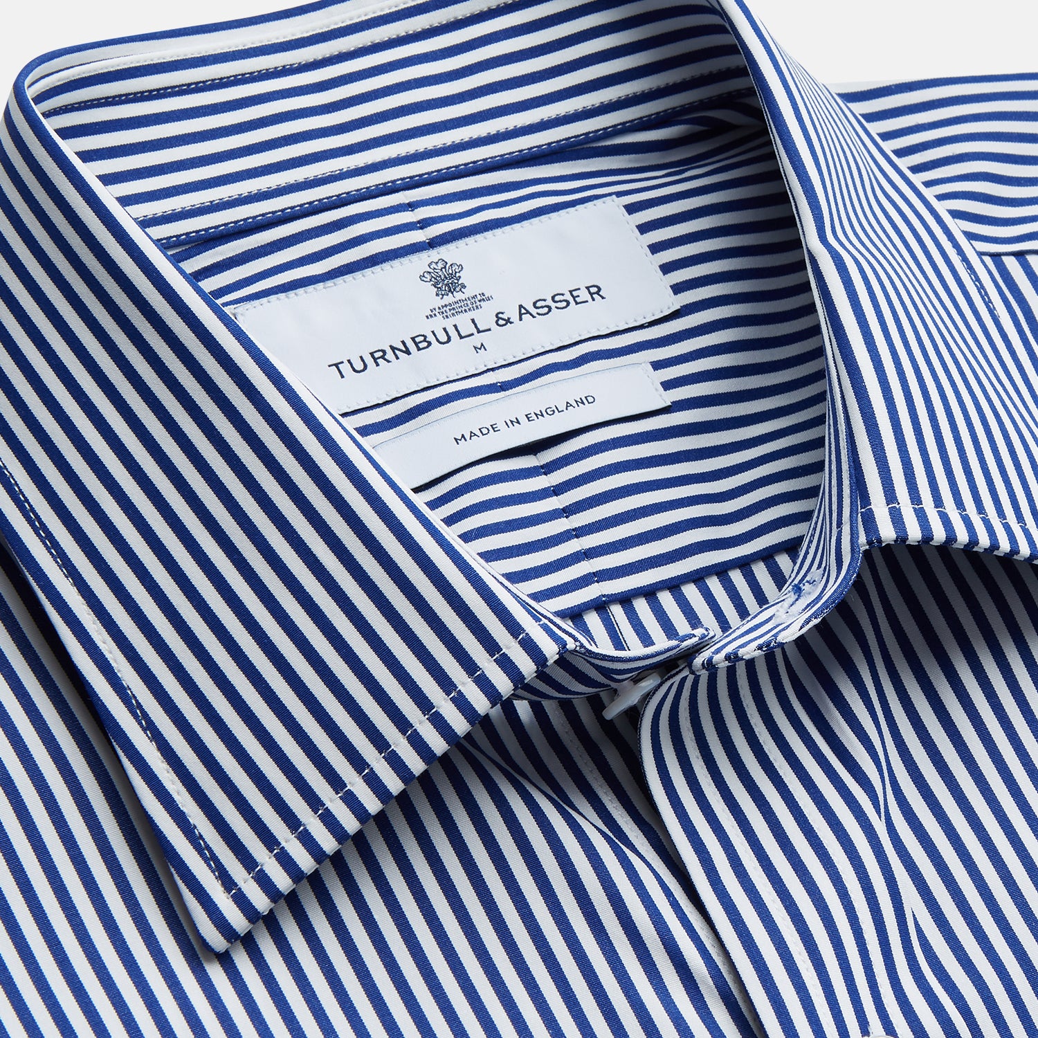 View 2 of product The Turnbull & Asser Navy & White Stripe Weekend Fit Shirt features a Derby collar, 1-button cuffs, front chest pocket, vertical stripes, and white buttons. Displayed flat on a white background.