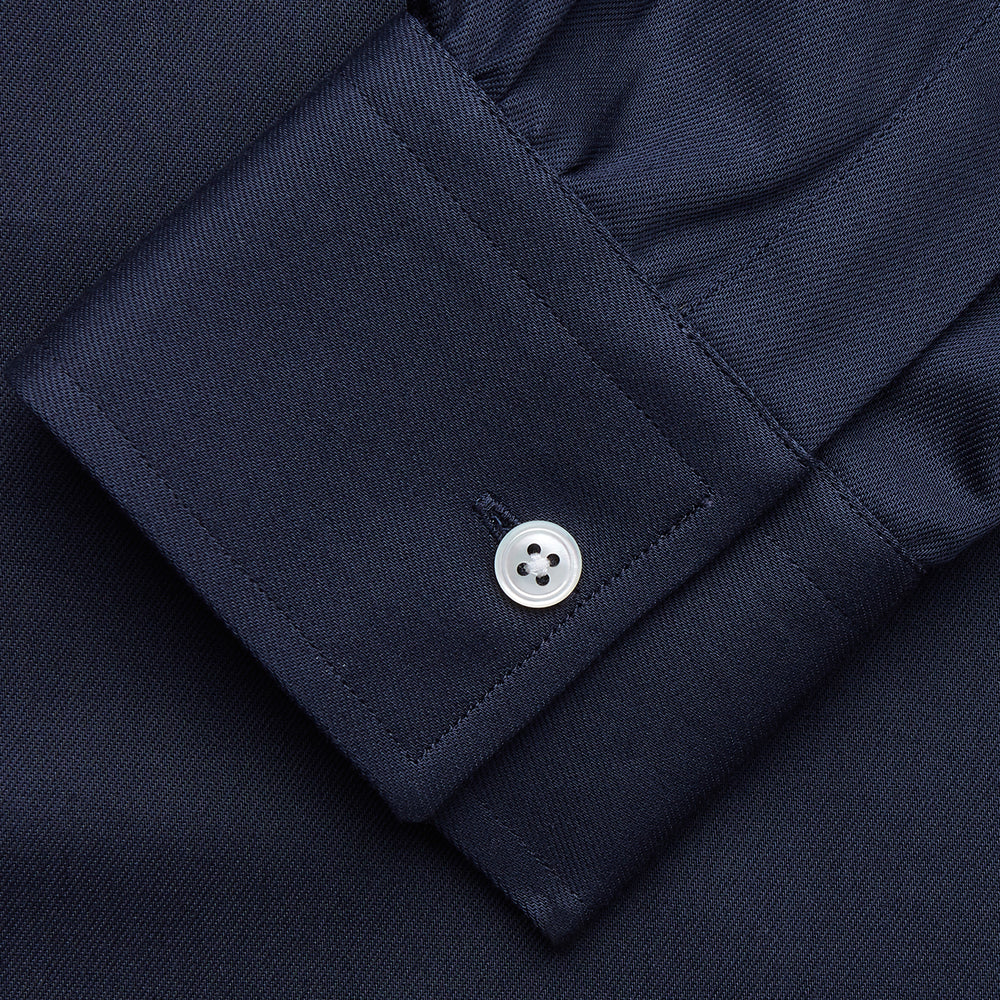 The Turnbull & Asser Navy Weekend Fit Shirt features a Dorset collar, 1 button cuffs, and white buttons, shown laid flat against a white background.