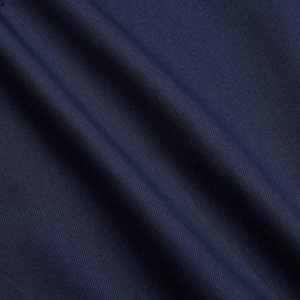 The Turnbull & Asser Navy Weekend Fit Shirt features a Dorset collar, 1 button cuffs, and white buttons, shown laid flat against a white background.