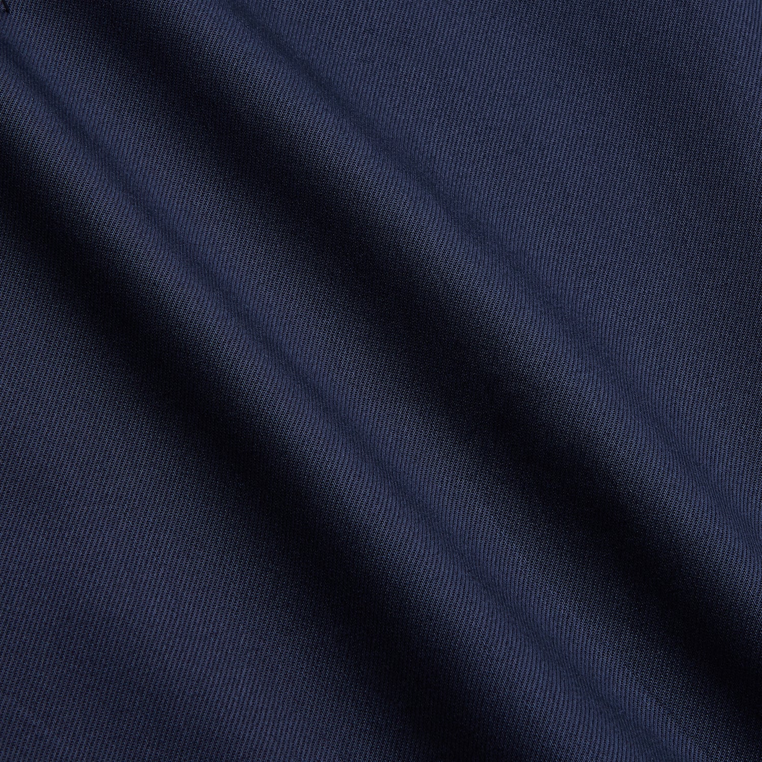 View 4 of product The Turnbull & Asser Navy Weekend Fit Shirt features a Dorset collar, 1 button cuffs, and white buttons, shown laid flat against a white background.