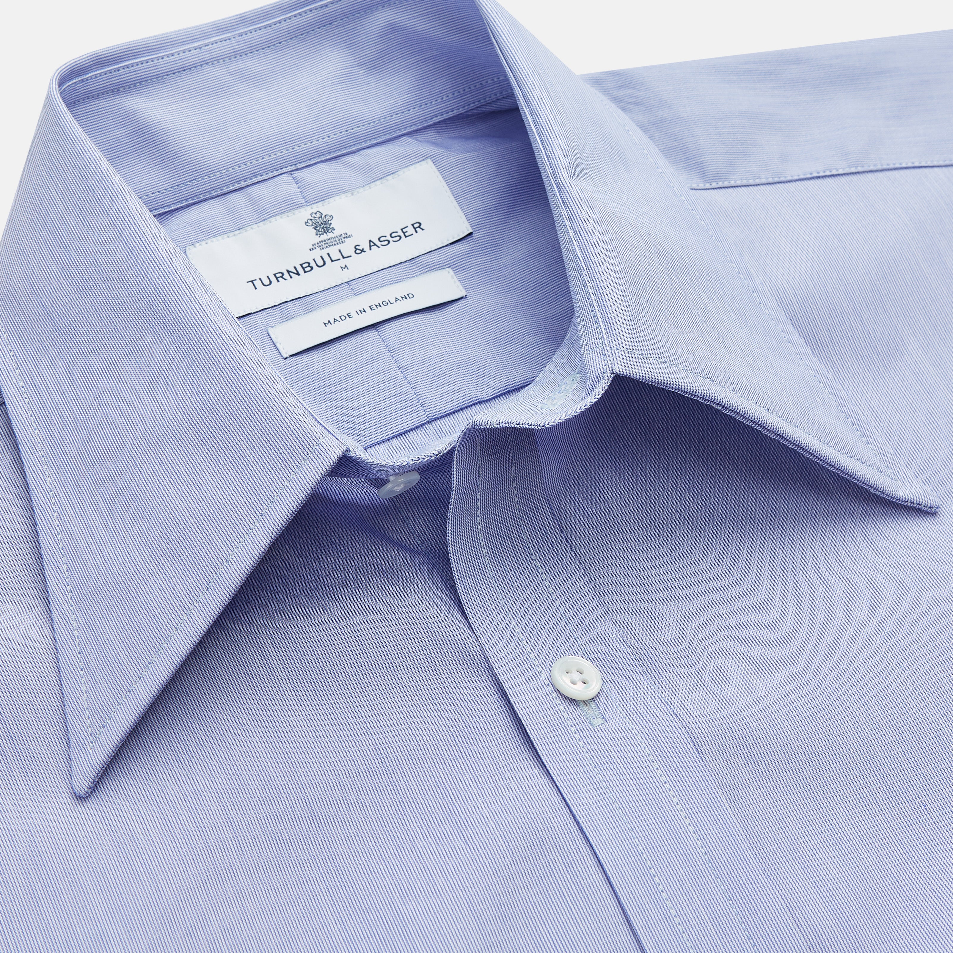View 2 of product The Turnbull & Asser Pale Blue Weekend Fit Shirt with a Long Point collar and single button cuffs is laid flat on a white background.