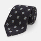The Turnbull & Asser Navy Multi Geo Silk Tie features a dark navy blue geometric pattern with blue and cream squares—ideal for pairing with bold signature shirts from the autumn-winter collection.