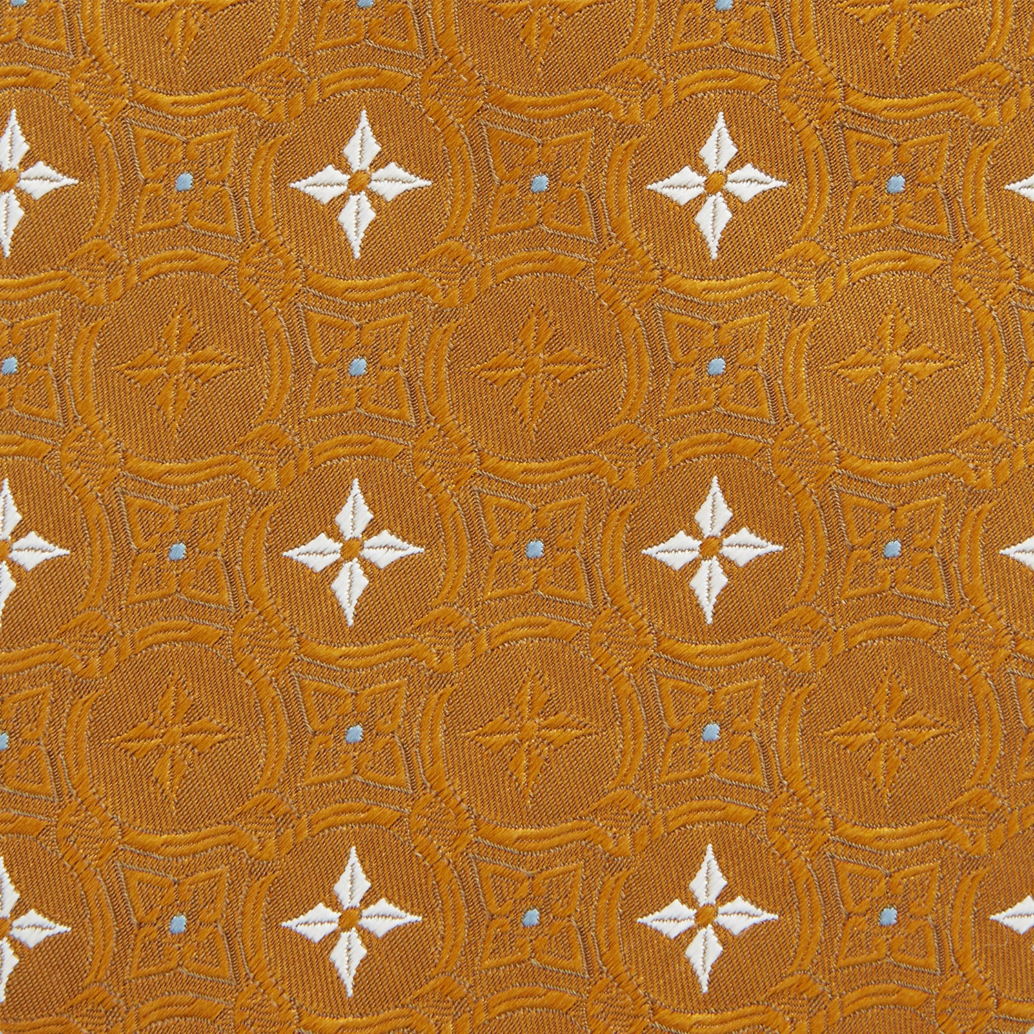 View 3 of product The Orange Multi Neat Silk Tie by Turnbull & Asser, from the autumn-winter collection, features a golden yellow geometric pattern on textured silk. Shown rolled on a white background, it pairs perfectly with bold signature shirts.