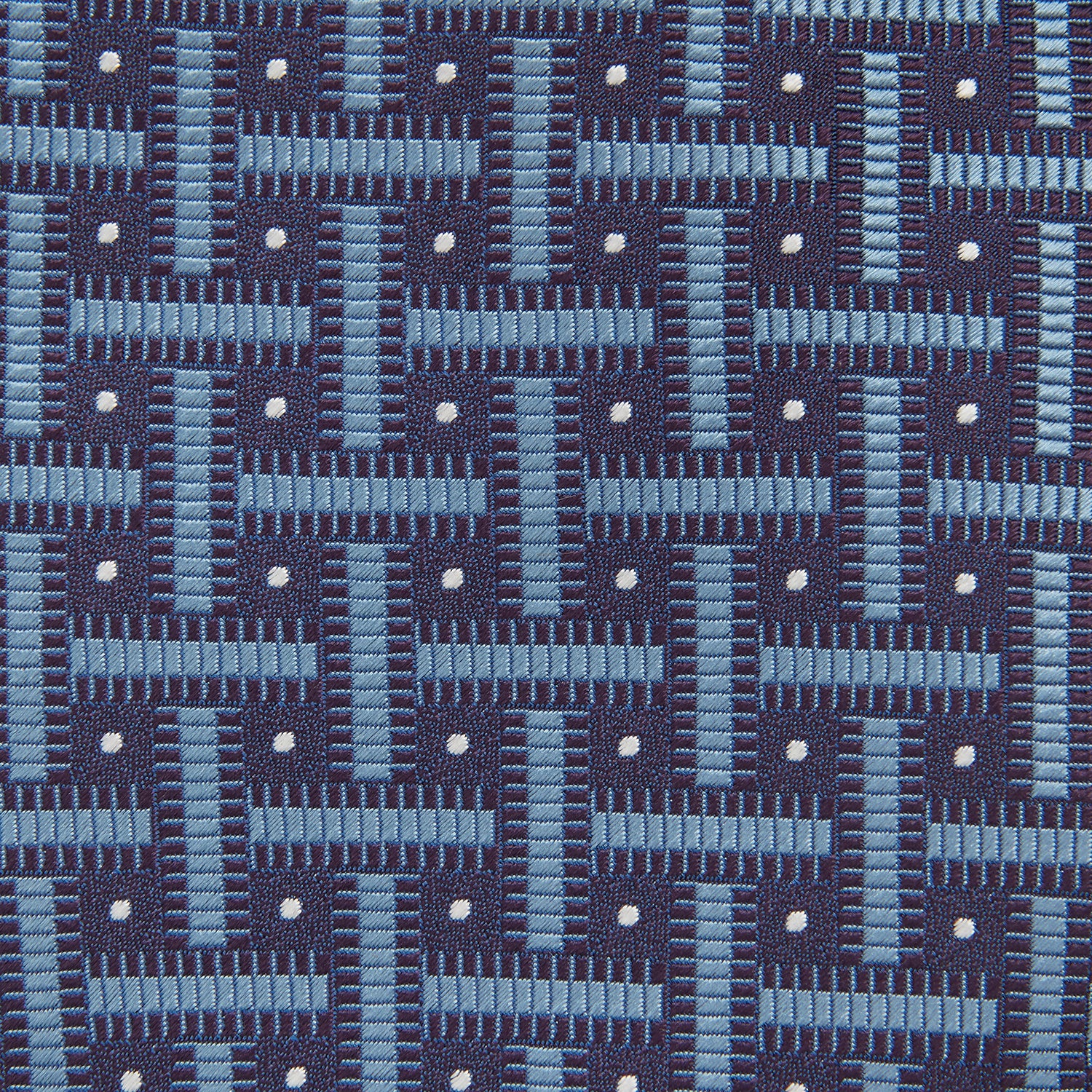 View 3 of product The Turnbull & Asser Navy & Blue Cross Silk Tie features a navy silk base with light blue and white geometric patterns and small white dots—ideal for elevating formal looks or pairing with signature shirts.