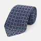 The Turnbull & Asser Navy & Blue Cross Silk Tie features a navy silk base with light blue and white geometric patterns and small white dots—ideal for elevating formal looks or pairing with signature shirts.